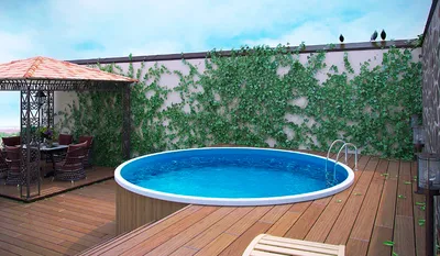 Каркасный бассейн с деревянной террасой. Идеи для оформления с фото.