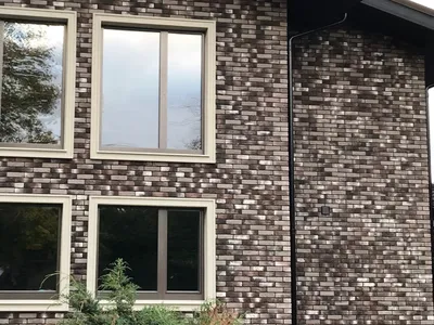 Фасад дома с натуральным камнем – фото отделки (облицовки) фасада камнем