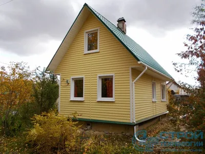 Фото домов с фасадными панелями Docke-R Burg - сайдинг под камень