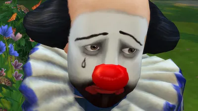 Фото грустного клоуна в костюме