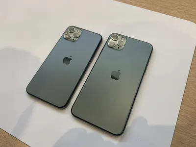 Phone 12 Pro Max in Gold next to iPhone 11 Pro Max in Midnight Green color  Stock Photo - Alamy