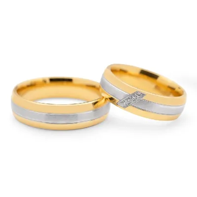 Обручальные кольца с бриллиантом(0,027 ct.) из платины и золота Купить в  Москве