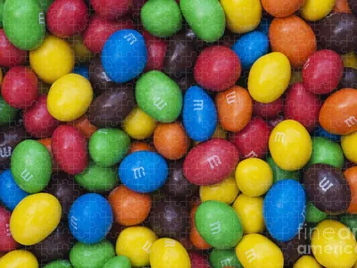 KHARKIV, UKRAINE - JANUARY 2, 2021 M and Ms colorful button shaped  chocolate candies. Multi colored chocolates each of which has the letter m  printed in lower case in white 33853897 Stock Photo at Vecteezy
