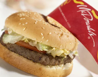 LONDON, UK - June 2022: McDonalds iconic logo against a yellow background.  McDonalds is a global fast food business Stock Photo | Adobe Stock