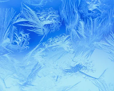 Зимние узоры на стекле, нарисованные морозом