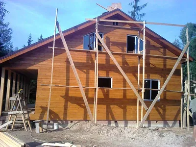 Проект уютного каркасного дома с двускатной крышей