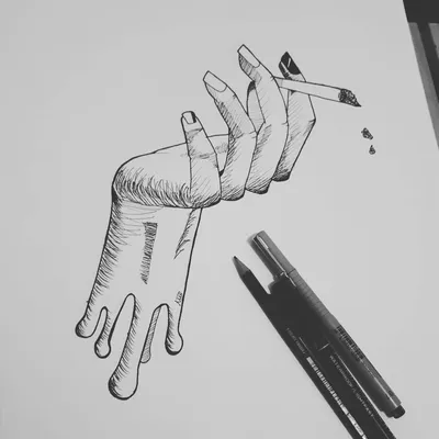 Изображение руки, держащей сигарету