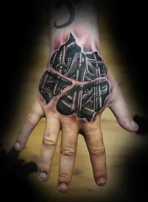 Картинка тату биомеханика на руке: выразительный образ