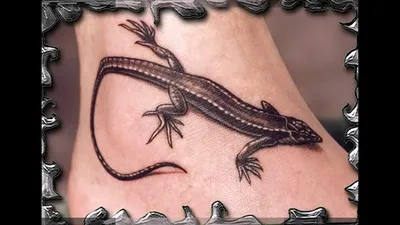 Изображение татуировки ящерицы на руке в стиле азиатской татуировки