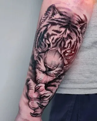 Фото тату тигра на руке: впечатляющий выбор для любителей животных
